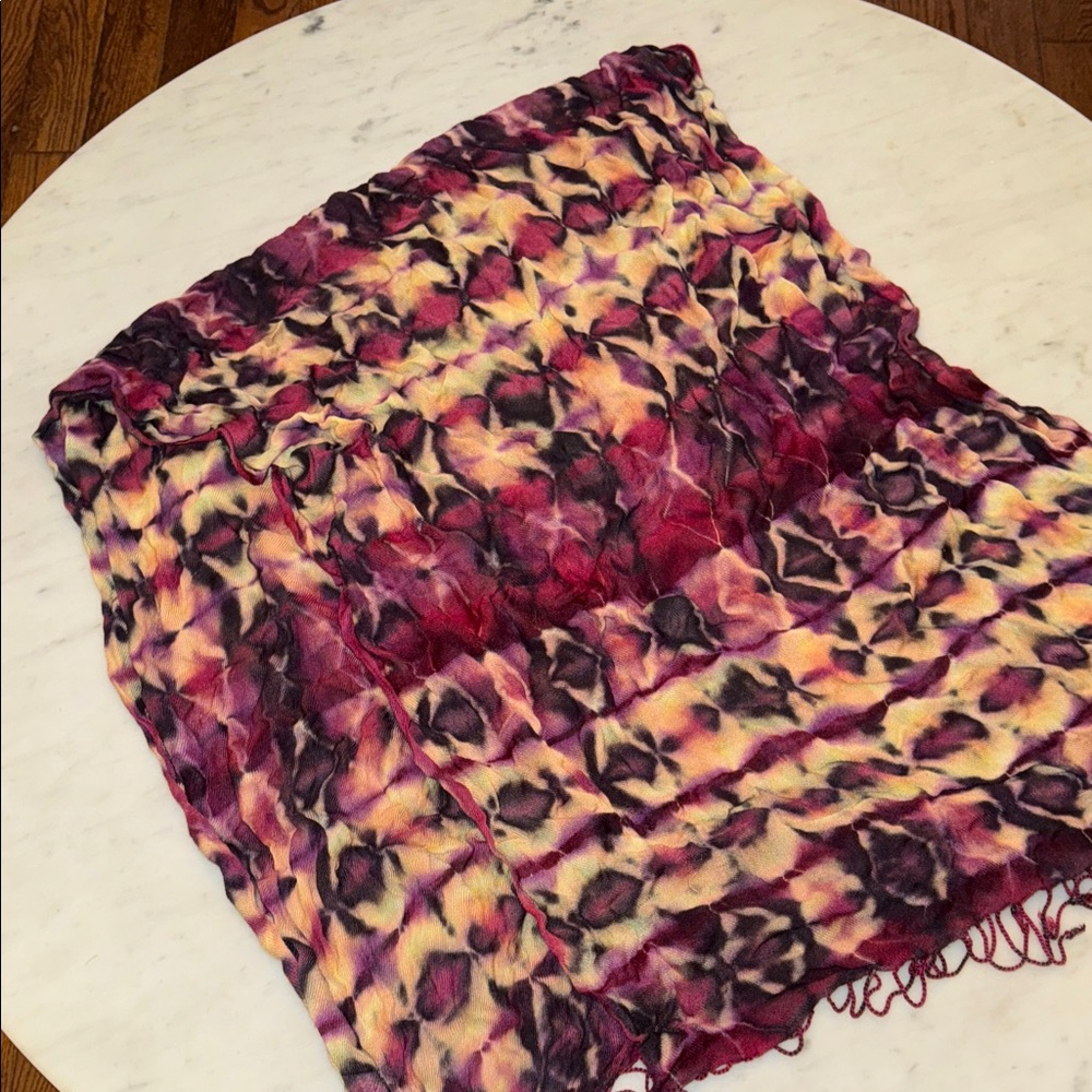 Brightly twisted multicolored, tie-dyed scarf. Made of linen/viscose. Like new